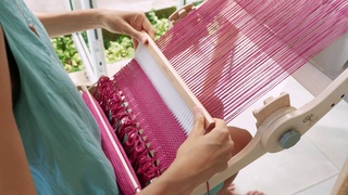 Weaving on an Ashford Knitters loom in Thailand. Fran Caselli